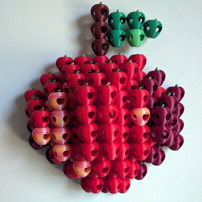 Cultivar01 Cultivar. Relief Sculpture of apple made of plastic red apples.